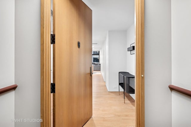 hallway with light wood-type flooring