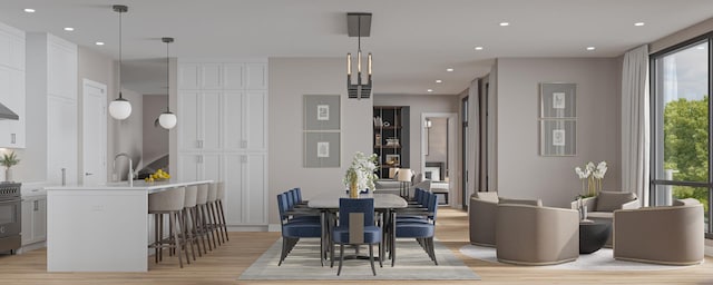 dining space featuring light wood-type flooring and recessed lighting