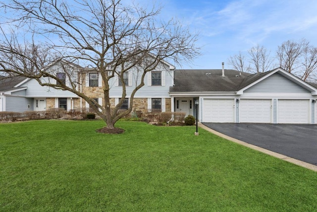 view of front of house featuring a garage, driveway, stone siding, roof with shingles, and a front lawn