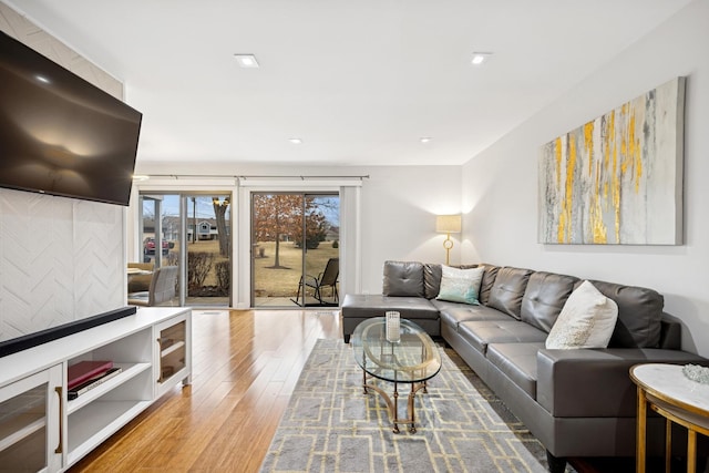 living room featuring wood finished floors and recessed lighting