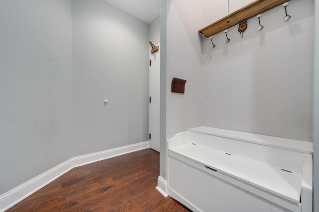 interior space featuring dark wood-type flooring and baseboards