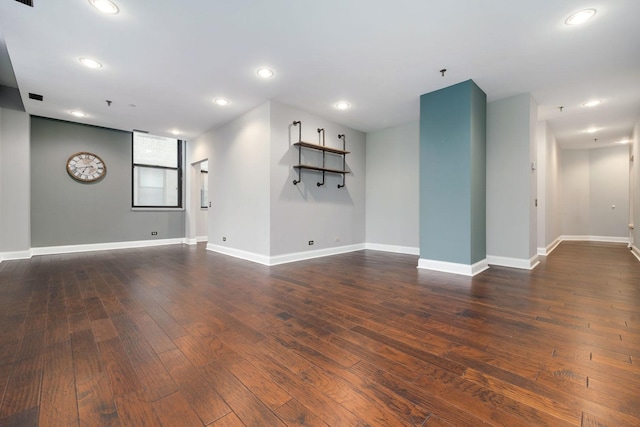 interior space with recessed lighting, baseboards, and dark wood-style floors