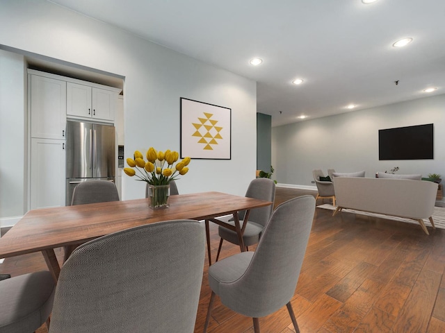 dining room featuring recessed lighting, dark wood-style flooring, and baseboards