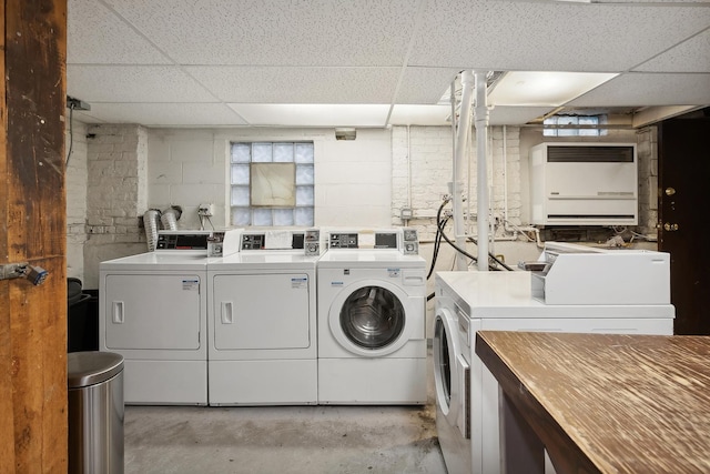 community laundry room with washer and clothes dryer and heating unit