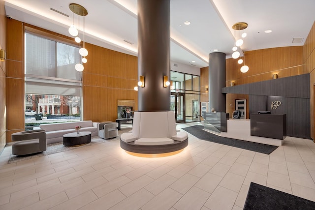 501 N Clinton St Unit 1705, Chicago, IL 60654 - community lobby with wood walls, a high ceiling, and floor to ceiling windows