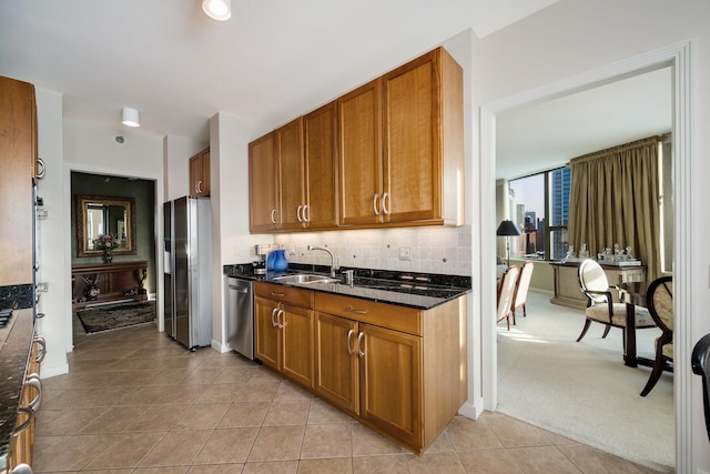 501 N Clinton St Unit 1705, Chicago, IL 60654 - kitchen with appliances with stainless steel finishes, brown cabinets, tasteful backsplash, and light tile patterned floors