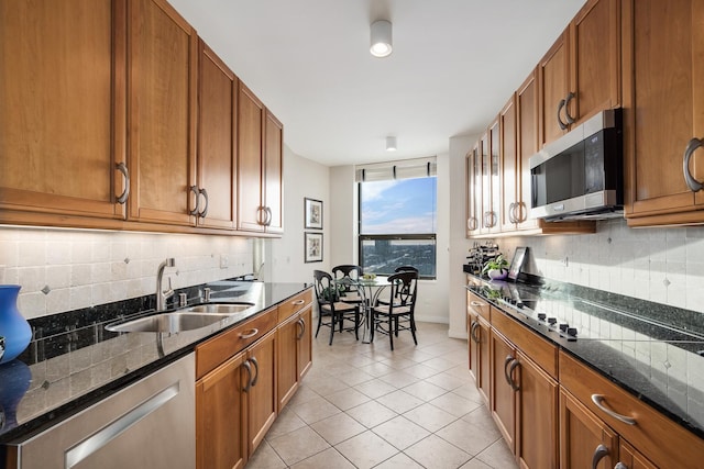 501 N Clinton St Unit 1705, Chicago, IL 60654 - kitchen with appliances with stainless steel finishes, tasteful backsplash, and brown cabinetry
