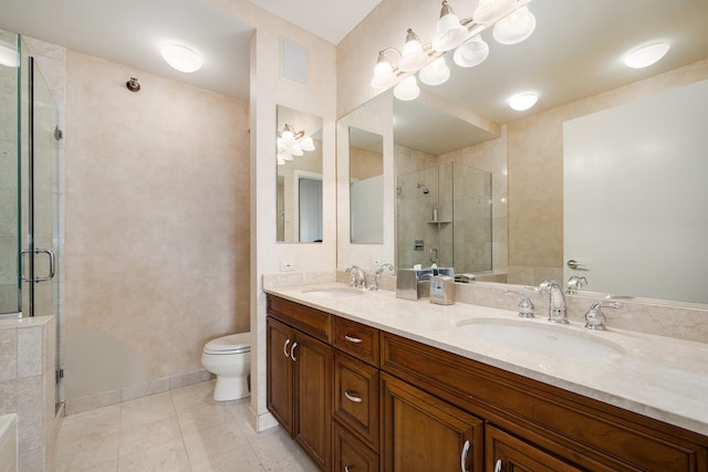 501 N Clinton St Unit 1705, Chicago, IL 60654 - bathroom featuring a shower stall, double vanity, and tile patterned flooring