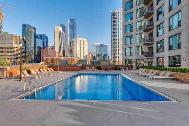 501 N Clinton St Unit 1705, Chicago, IL 60654 - community pool featuring a view of skyline and a patio area