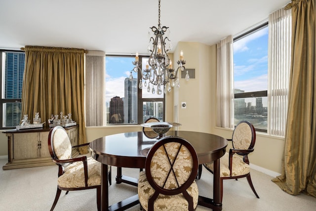 501 N Clinton St Unit 1705, Chicago, IL 60654 - dining area featuring light colored carpet and a chandelier