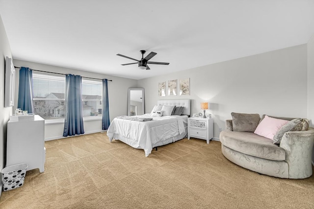 bedroom featuring carpet, baseboards, and a ceiling fan