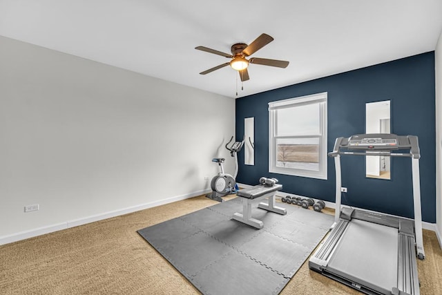 workout room featuring a ceiling fan, carpet floors, and baseboards