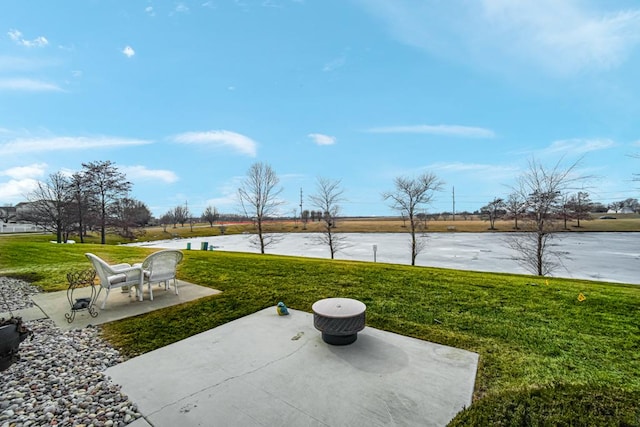 view of patio featuring a water view