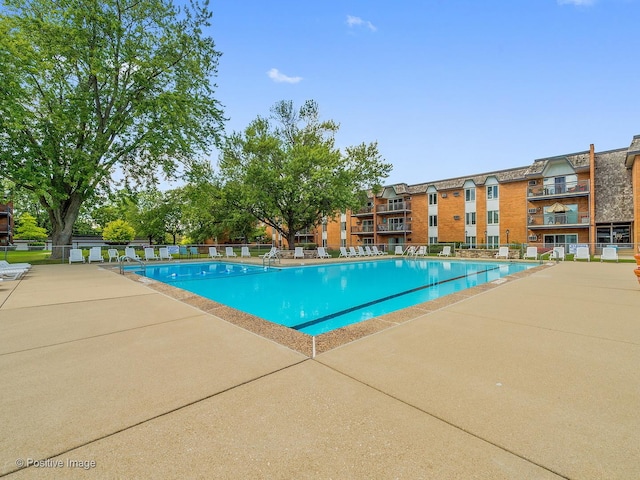 view of pool with fence