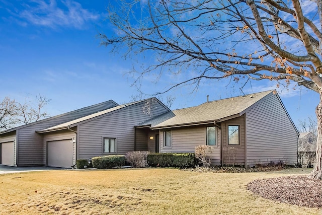 view of front of home with a garage and a front yard