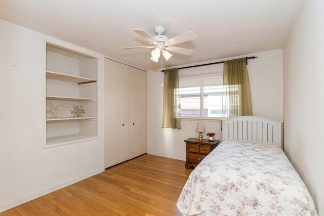 bedroom featuring a ceiling fan and wood finished floors