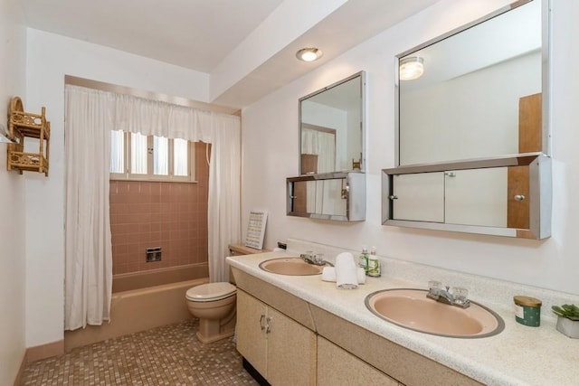 bathroom featuring toilet, shower / tub combo, double vanity, and a sink