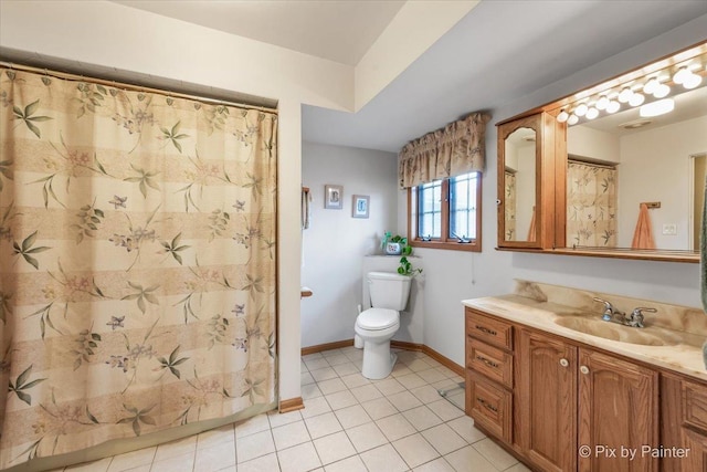 bathroom with baseboards, toilet, tile patterned floors, curtained shower, and vanity