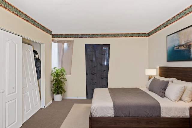 bedroom featuring carpet floors and baseboards