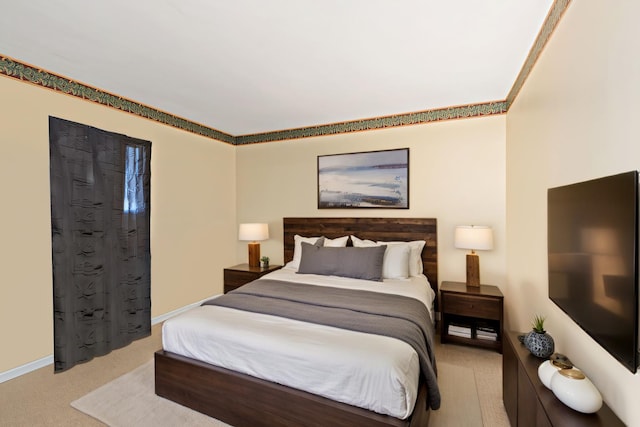 carpeted bedroom featuring baseboards