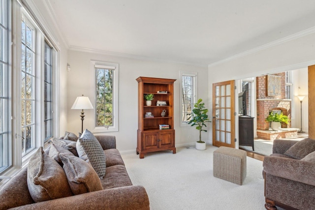 living room with baseboards, ornamental molding, carpet, and a brick fireplace