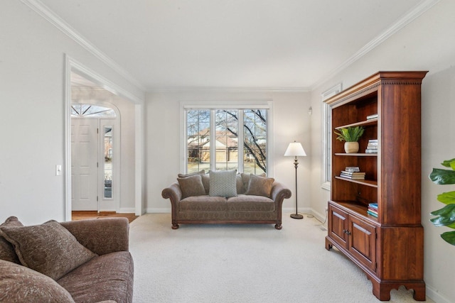 living room featuring light colored carpet, crown molding, and baseboards