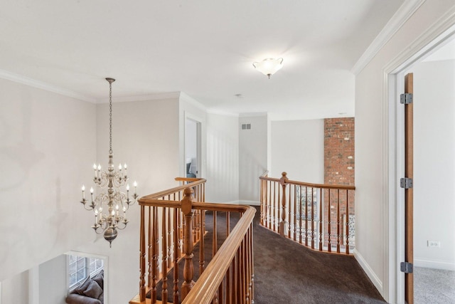 hall with baseboards, carpet, visible vents, and crown molding