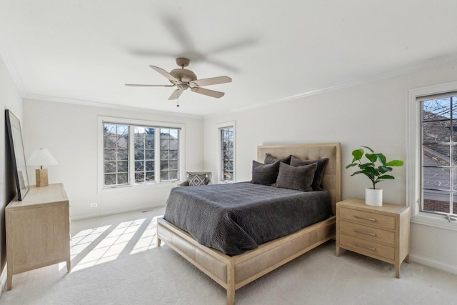 bedroom featuring light carpet, crown molding, baseboards, and ceiling fan