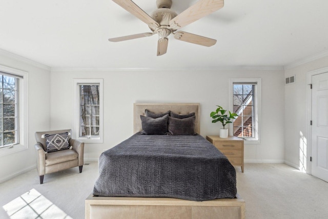 bedroom with multiple windows, carpet flooring, and visible vents