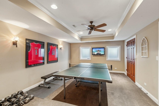 game room featuring visible vents, baseboards, a tray ceiling, carpet, and crown molding