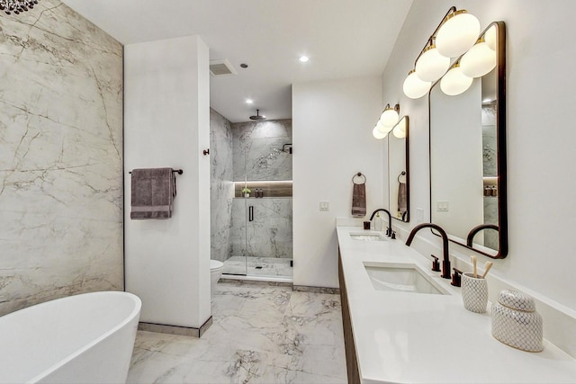 full bath with marble finish floor, a marble finish shower, a sink, and visible vents