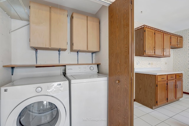 laundry room with light tile patterned floors, independent washer and dryer, and wallpapered walls