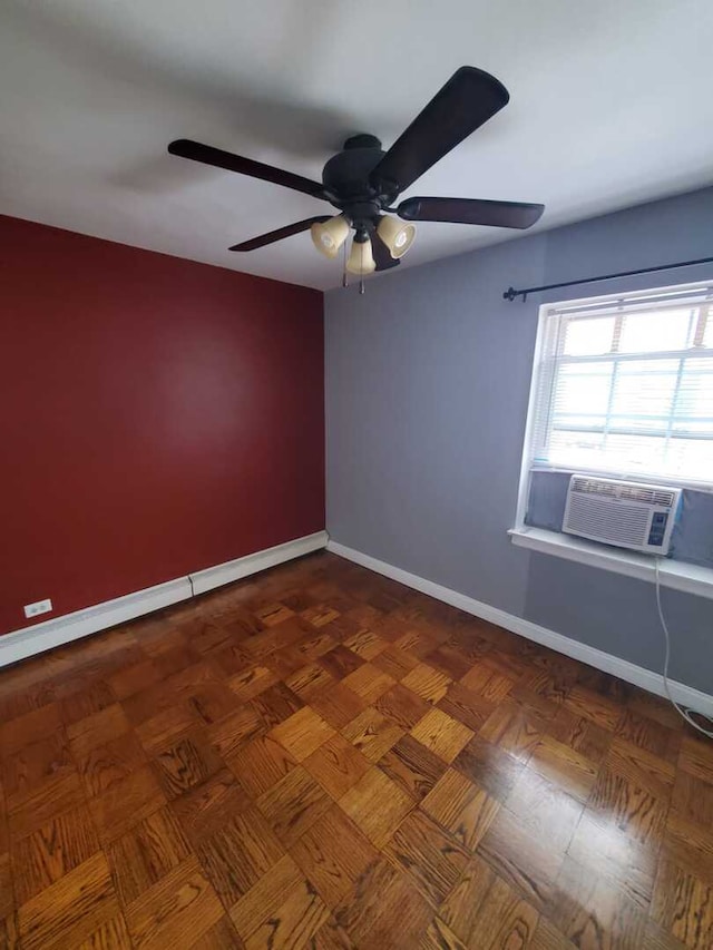 unfurnished room featuring cooling unit, a ceiling fan, and baseboards