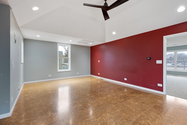 unfurnished room featuring a towering ceiling, baseboards, a ceiling fan, and recessed lighting