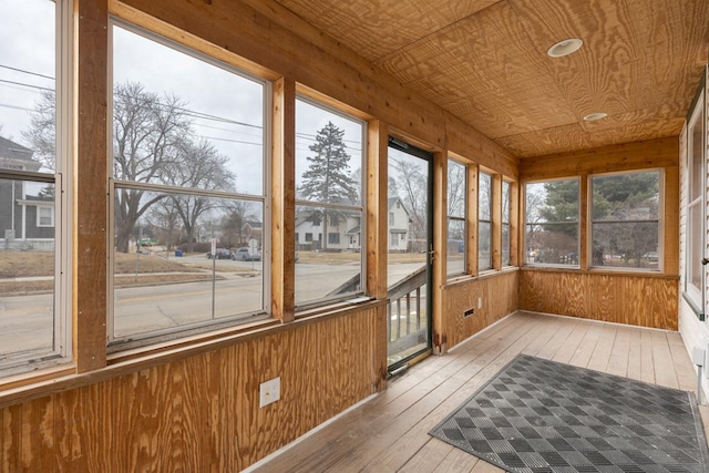 unfurnished sunroom featuring wood ceiling