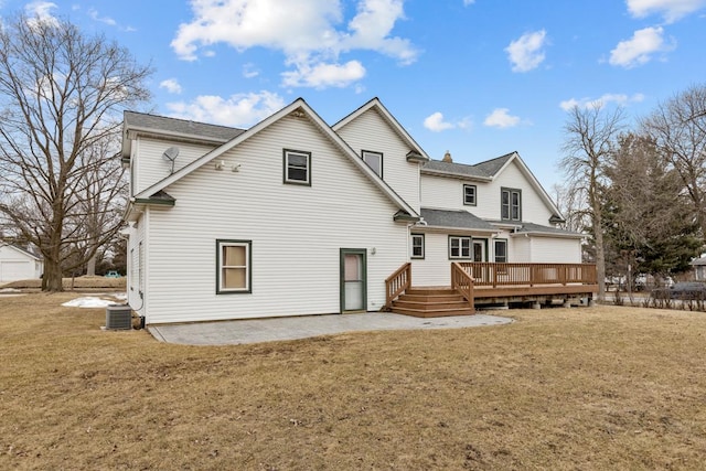 back of property with a patio, a lawn, cooling unit, and a wooden deck