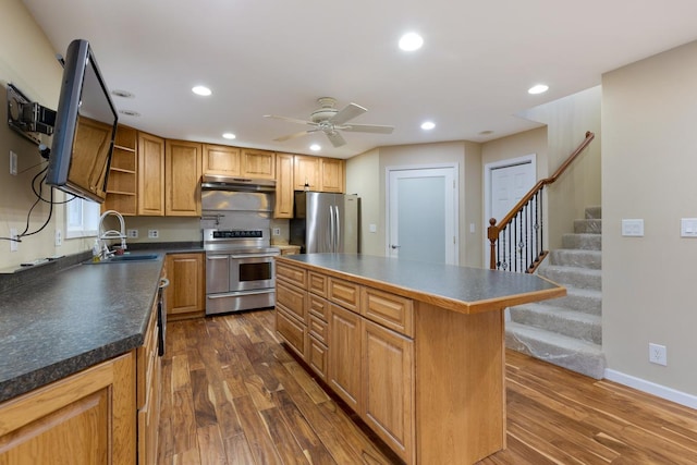 kitchen featuring stainless steel appliances, dark wood-type flooring, a sink, and open shelves