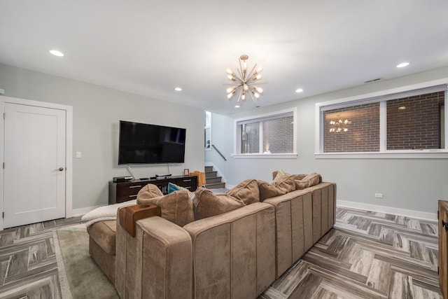 living room with a chandelier, recessed lighting, visible vents, baseboards, and stairs