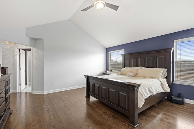 bedroom with dark wood-style floors, lofted ceiling, baseboards, and a ceiling fan