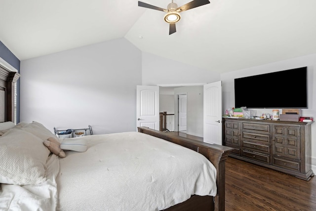 bedroom with lofted ceiling, dark wood-style floors, and a ceiling fan