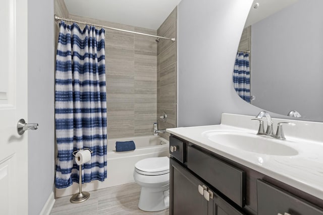 full bathroom featuring shower / bathtub combination with curtain, vanity, and toilet