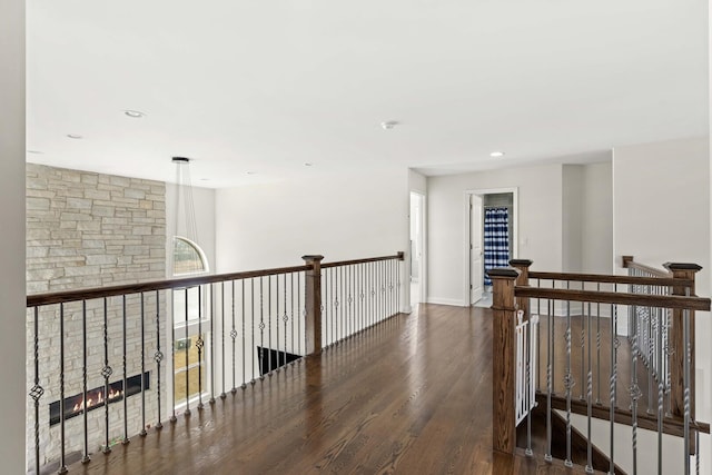 corridor featuring dark wood-style floors and recessed lighting