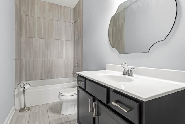 bathroom with washtub / shower combination, vanity, toilet, and tile patterned floors