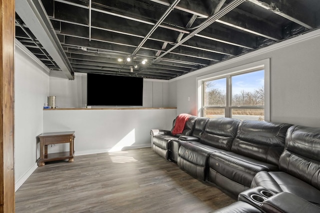 cinema room featuring baseboards and wood finished floors