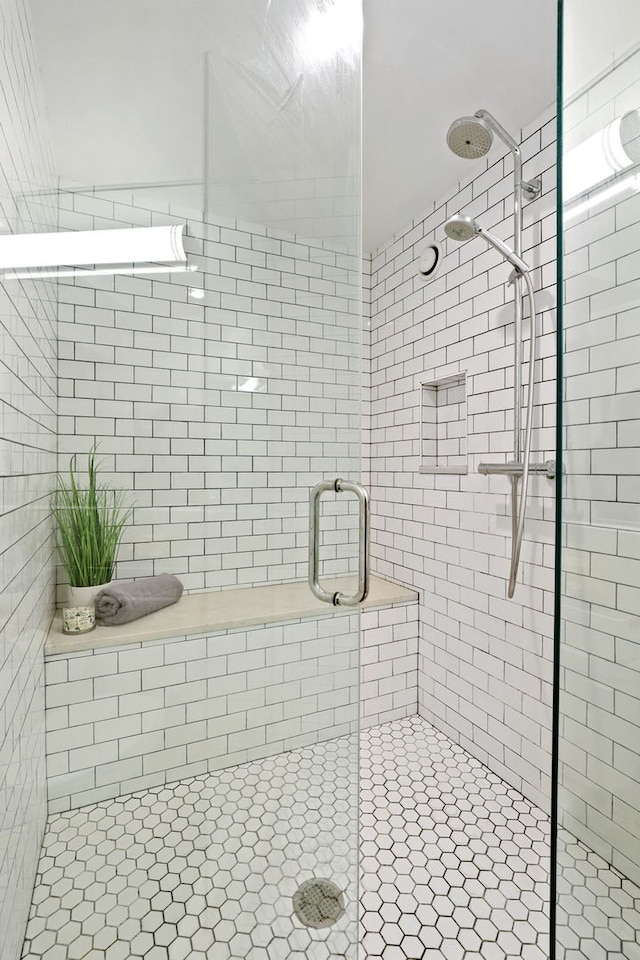 bathroom with a shower stall