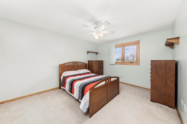 bedroom with carpet floors, baseboards, and a ceiling fan