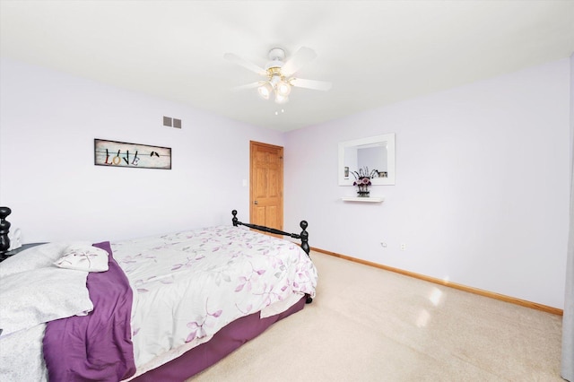 bedroom with ceiling fan, carpet floors, visible vents, and baseboards