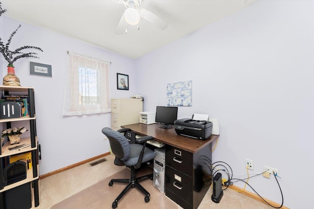 office with carpet, visible vents, ceiling fan, and baseboards