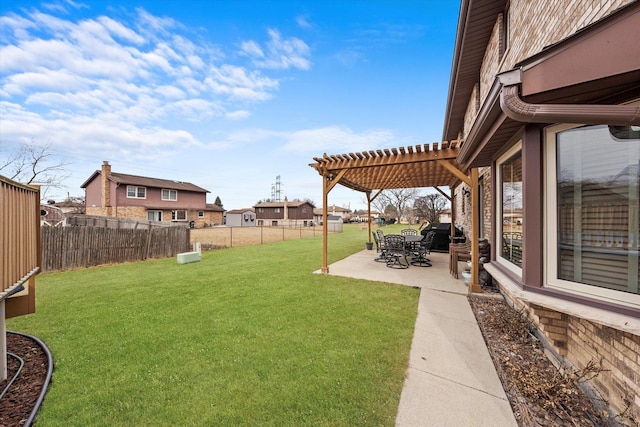 view of yard featuring a patio area, a fenced backyard, and a pergola