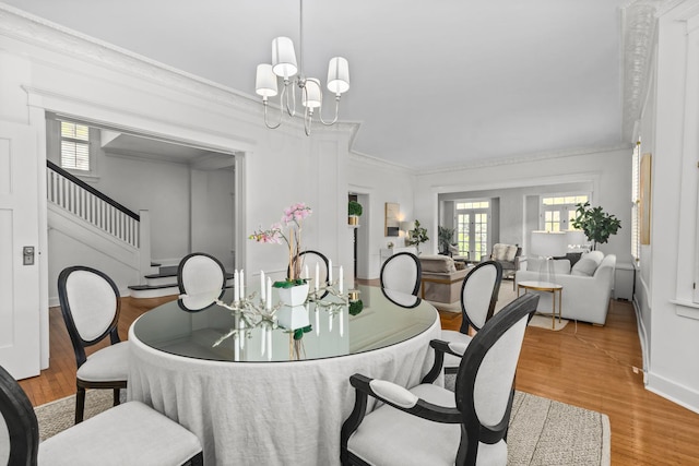 714 Sheridan Rd, Evanston, IL 60202 - dining area with plenty of natural light, crown molding, wood finished floors, and a chandelier